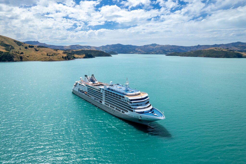 Luxury expedition cruise ship at sea with dramatic sky